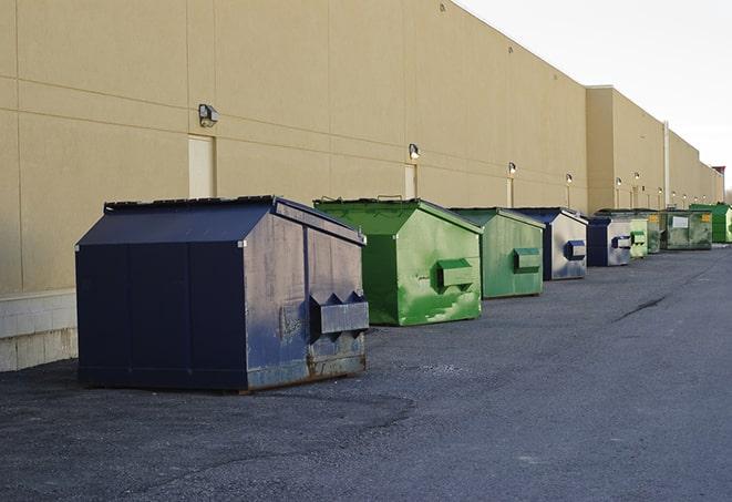 metal waste containers sit at a busy construction site in Carrollton, TX